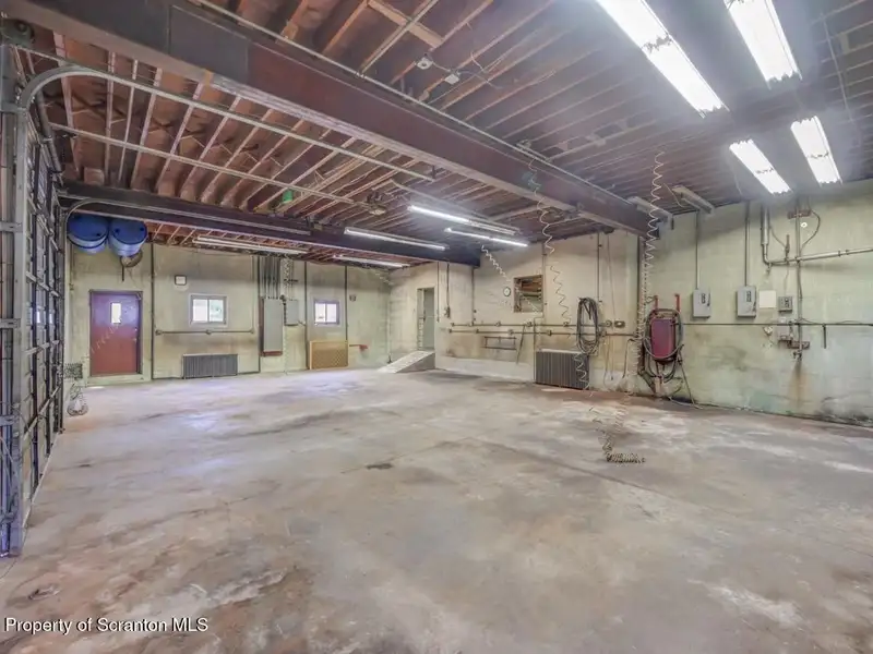 Mixed-use Property in Throop: 7-bay Garage and Updated 2-bedroom Apartment