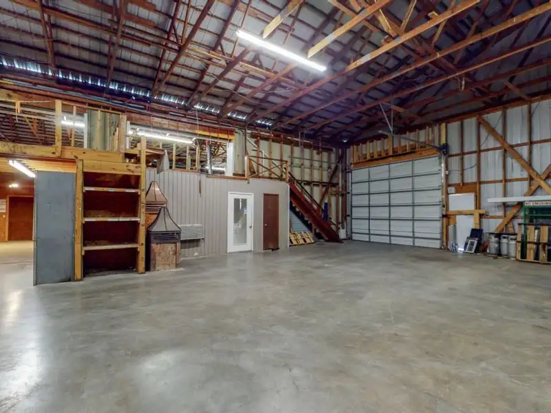 Commercial Property on Busy Highway - 2.1 Acres, 31,000 Sq Ft with Offices and Roll-up Doors