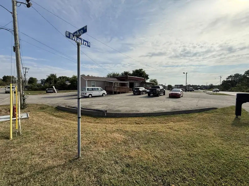 Prime Commercial Property with Office and Garage Space at Lake and East Main Intersection