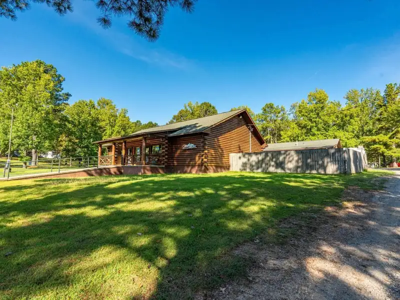 Established Log Cabin Liquor Store for Sale on Highway 70 with Drive-through Access