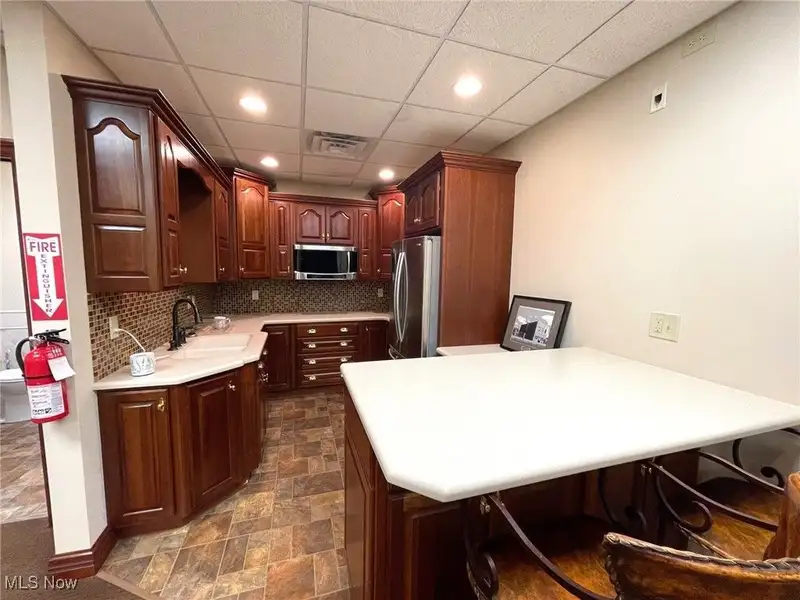Well-maintained Two-story Brick Building with Retail and Workshop Space in Ne Location