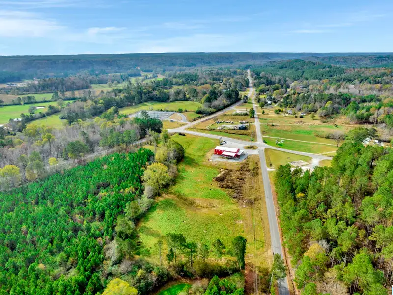 Prime Commercial Property Near Smith Lake with 3,800 Sq Ft Building and Billboard Income