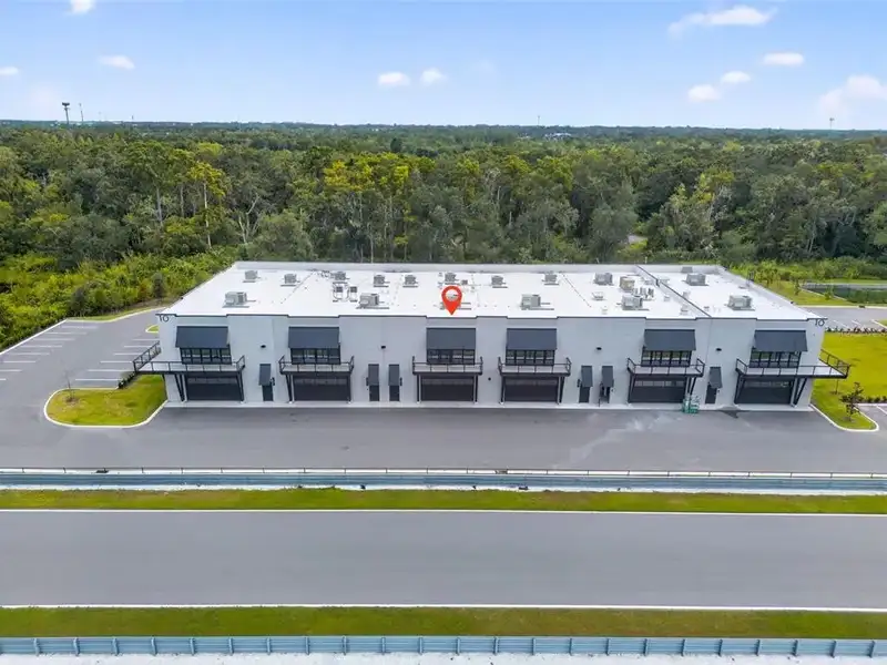 Exclusive Balcony Unit at the Motor Enclave with Private Garage and Racetrack Views