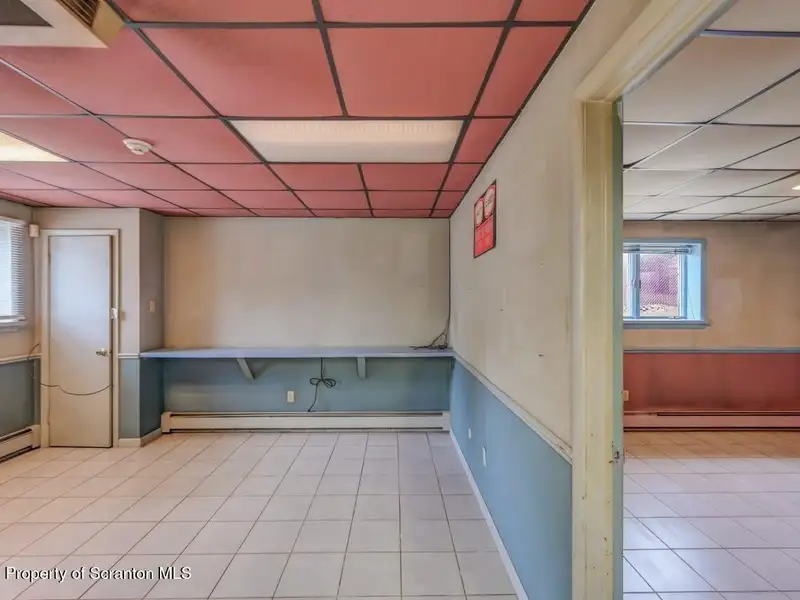 Mixed-use Property in Throop: 7-bay Garage and Updated 2-bedroom Apartment