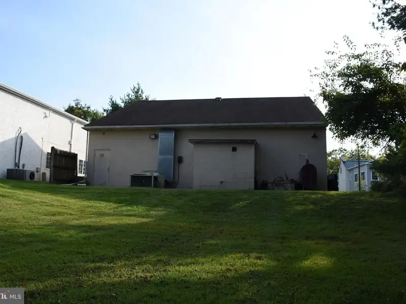 Versatile 3000+ Sq Ft Commercial Space in Prime Village Location with Auto Repair Facilities