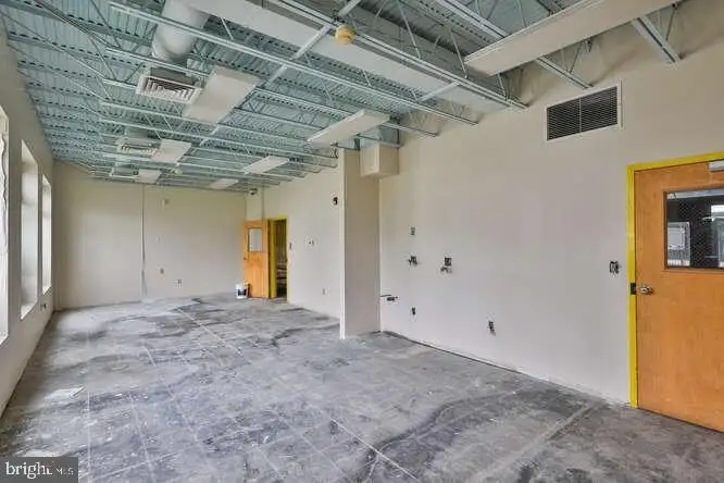 Versatile 6,000 Sq Ft Commercial Space in Prime Location with Parking Potential