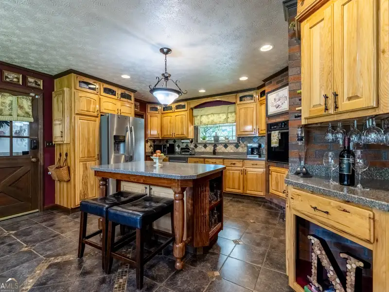 27 Acres with 2,400 Sq. Ft. Home, Duplexes, Pool, and Barn in Prime Location