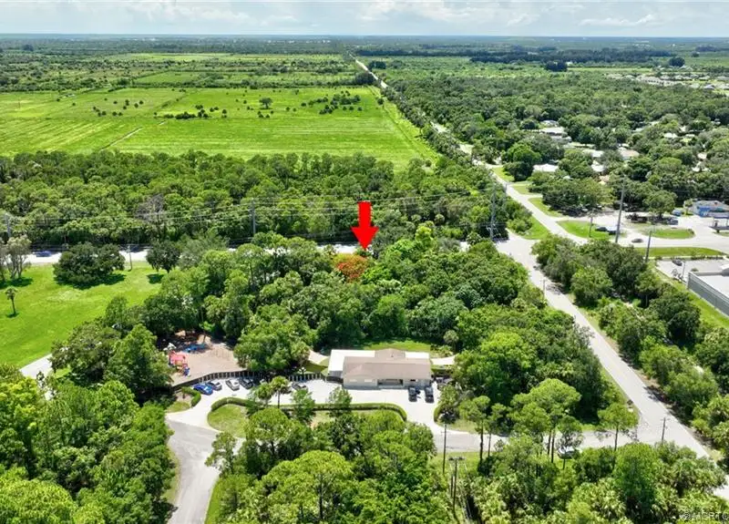 Commercial Corner Lot with Existing Residence in Lakewood Park, 31,140 Sq Ft