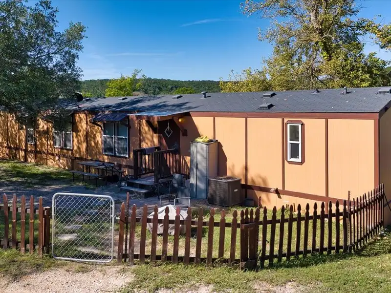 10-acre Mobile Home Community with 5 Units, Fenced, Workshop, and Growth Potential