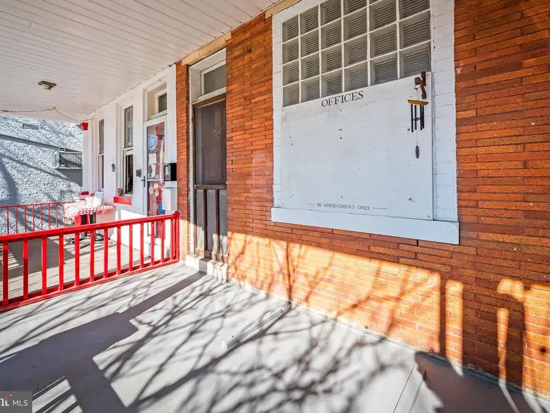 Multi-story Mixed-use Property with Apartment Potential in Prime Location