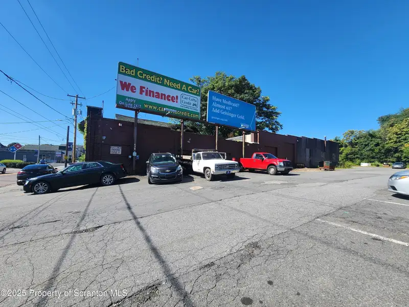 Versatile Commercial Property with Garage Bays and Billboard Income in Prime Location