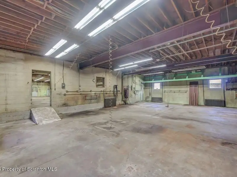 Mixed-use Property in Throop: 7-bay Garage and Updated 2-bedroom Apartment