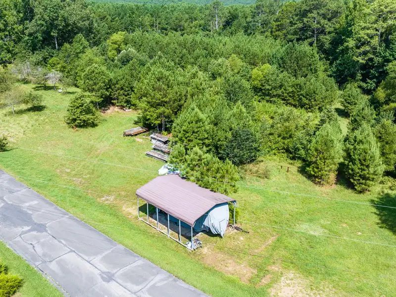 27 Acres with 2,400 Sq. Ft. Home, Duplexes, Pool, and Barn in Prime Location