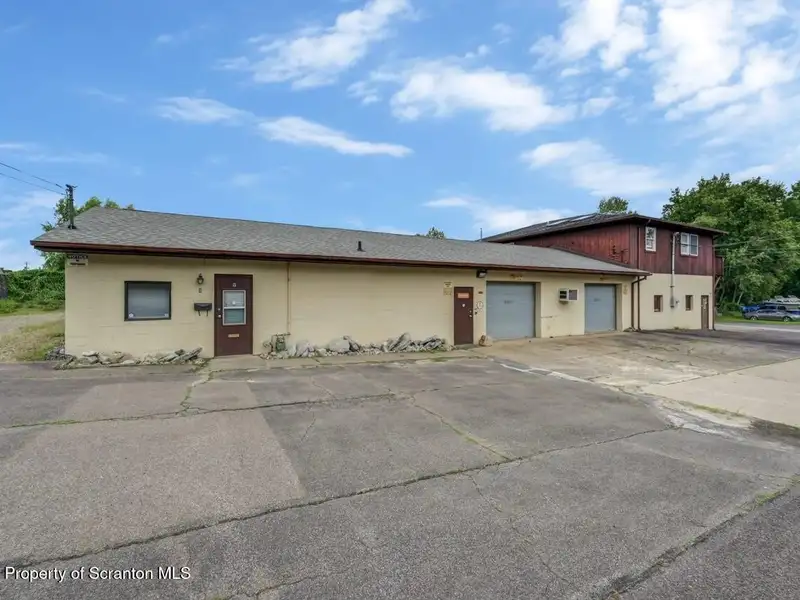 Mixed-use Property in Throop: 7-bay Garage and Updated 2-bedroom Apartment