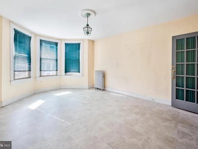 Multi-story Mixed-use Property with Apartment Potential in Prime Location