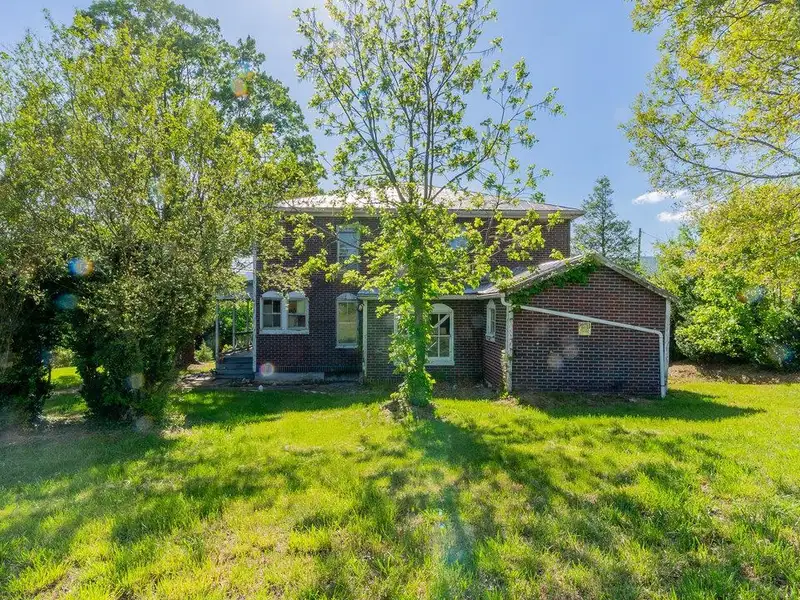 Classic American Foursquare Home in Need of Restoration with Detached Garage