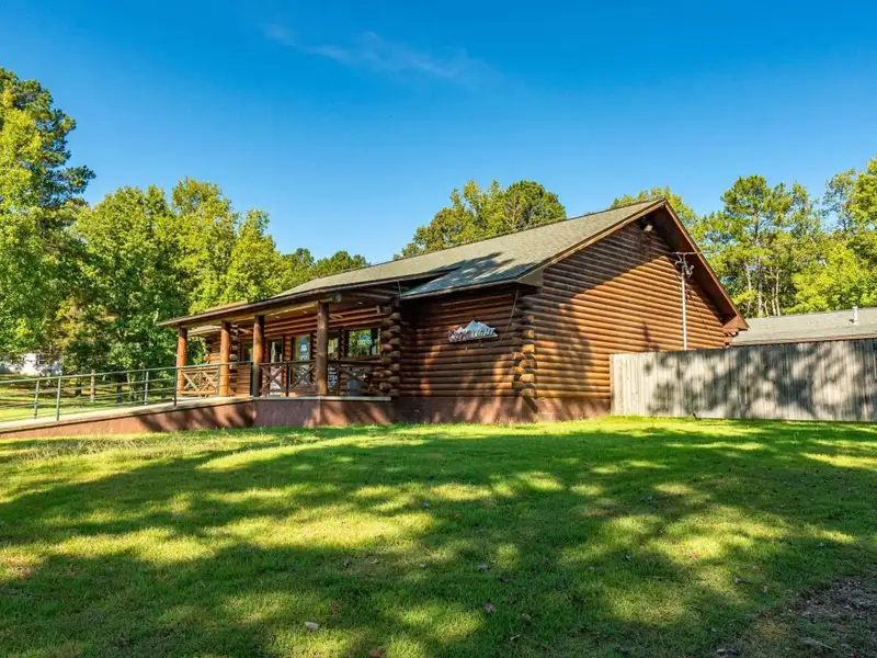 Established Log Cabin Liquor Store for Sale on Highway 70 with Drive-through Access