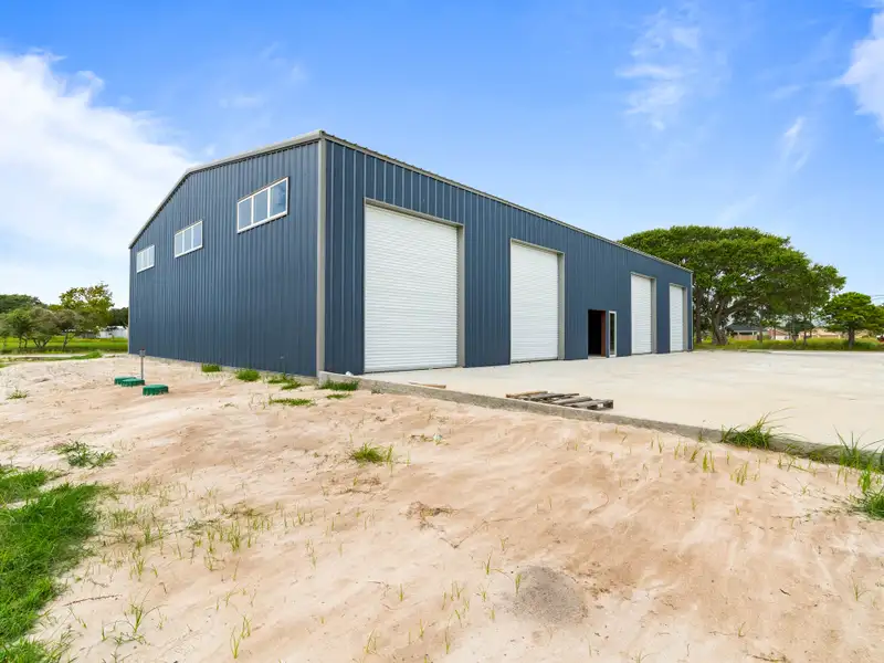 5,700 Sq Ft Warehouse on ½ Acre in Rockport, Texas with Highway Access and Parking