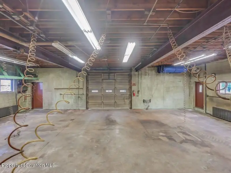 Mixed-use Property in Throop: 7-bay Garage and Updated 2-bedroom Apartment