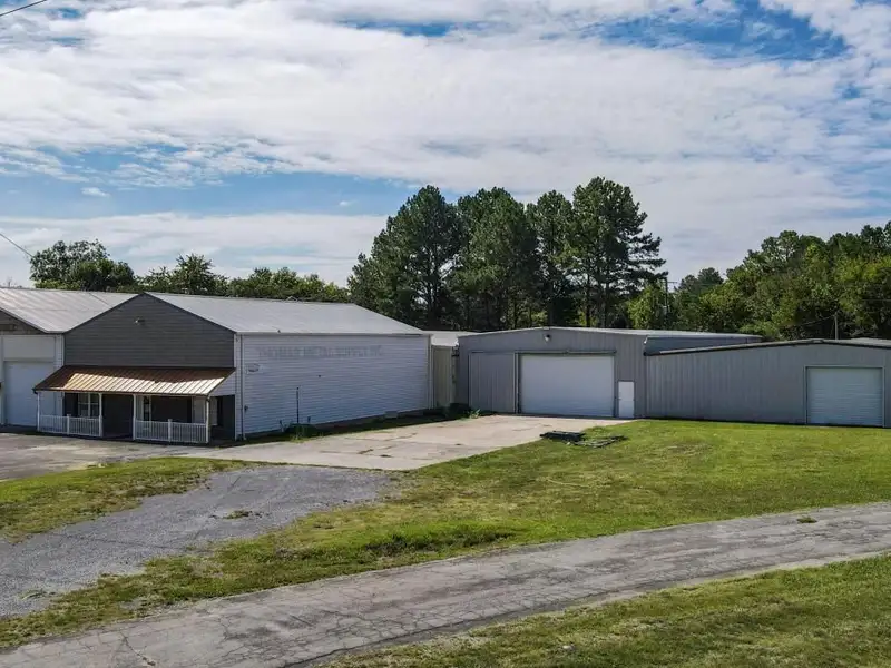 Commercial Property on Busy Highway - 2.1 Acres, 31,000 Sq Ft with Offices and Roll-up Doors