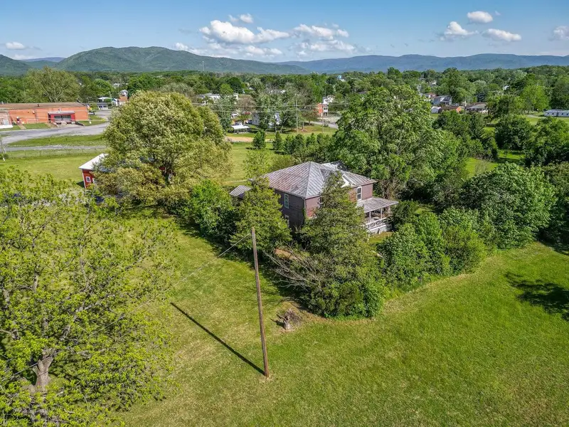 Classic American Foursquare Home in Need of Restoration with Detached Garage