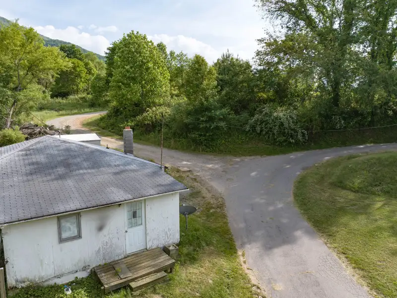 Historic 1918 Stone Building with 3.99 Acres and Detached Workshop in Balsam Road Area