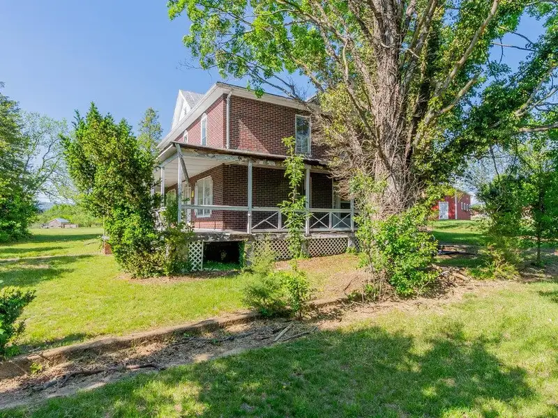 Classic American Foursquare Home in Need of Restoration with Detached Garage