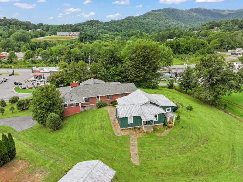 Prime 2.58-acre Multifunctional Property with Ranch Home and Outbuildings Near High-traffic Area