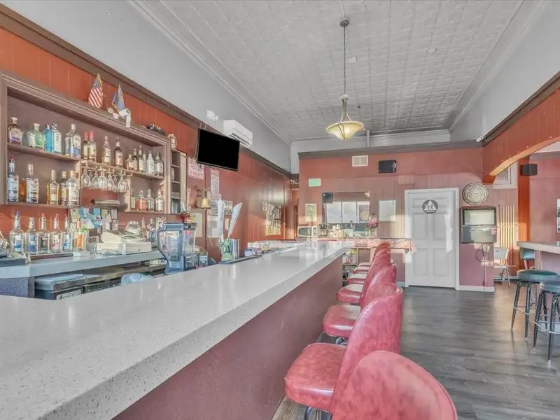 Versatile Corner Commercial Property with Retail Space and Two Apartments in Prime Location