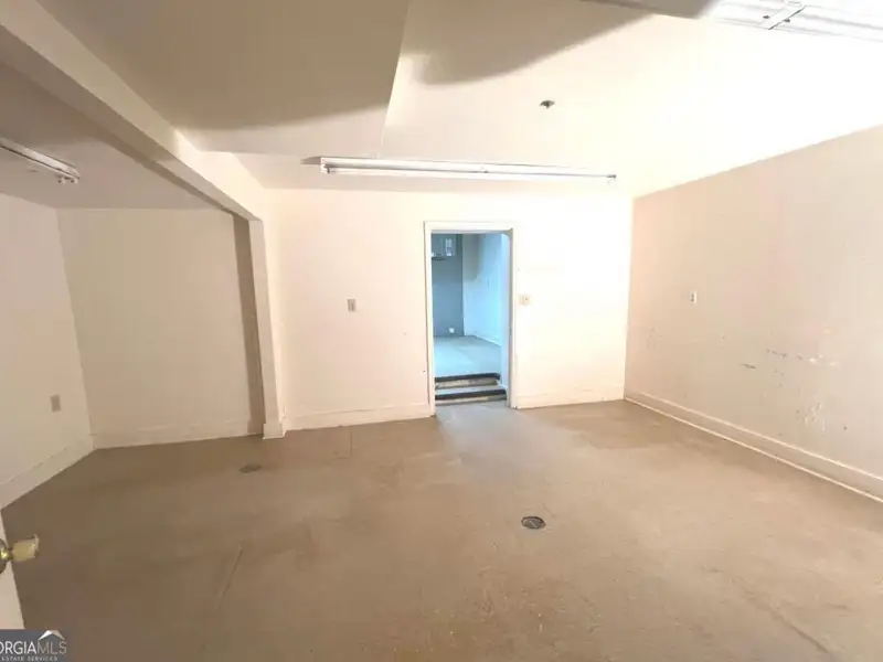 Two-level Commercial Unit with 26 Living/office Spaces in Re-zoned R4 Area