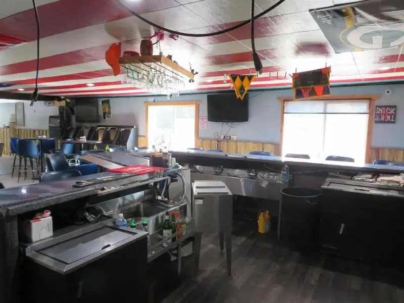 Turnkey Bar/restaurant with Apartment, Highway Access, and Development Potential in Northwoods