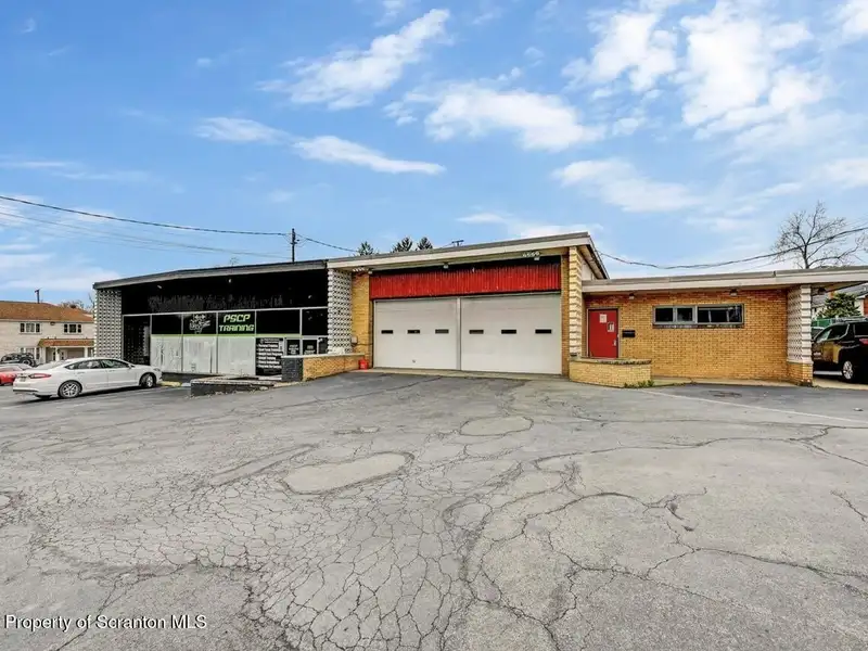 Mixed-use Building with Retail Space and Parking for Sale in Prime Location