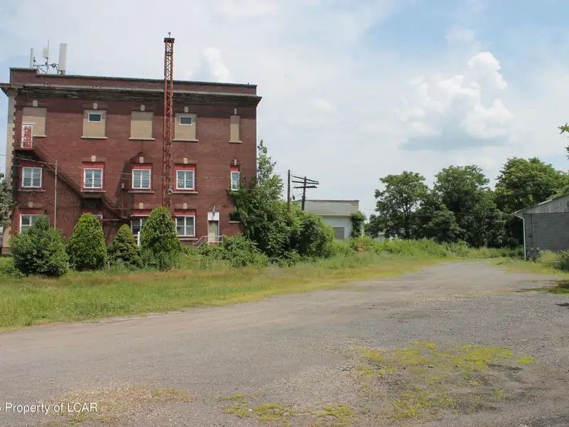 Former Municipal Building with Approved Plans for 12 or 15 Residential Units in Prime Location