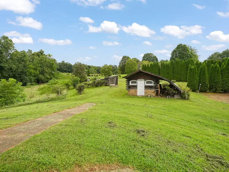 Prime 2.58-acre Multifunctional Property with Ranch Home and Outbuildings Near High-traffic Area