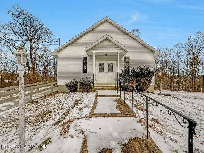 Versatile Former Church Building in Peaceful Location with Ample Parking and Creative Potential