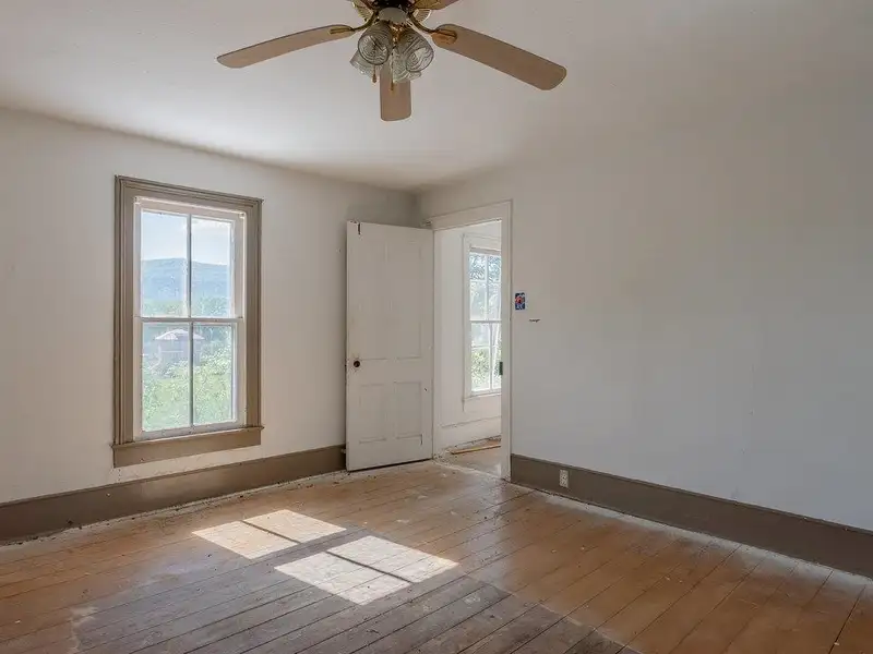 Classic American Foursquare Home in Need of Restoration with Detached Garage