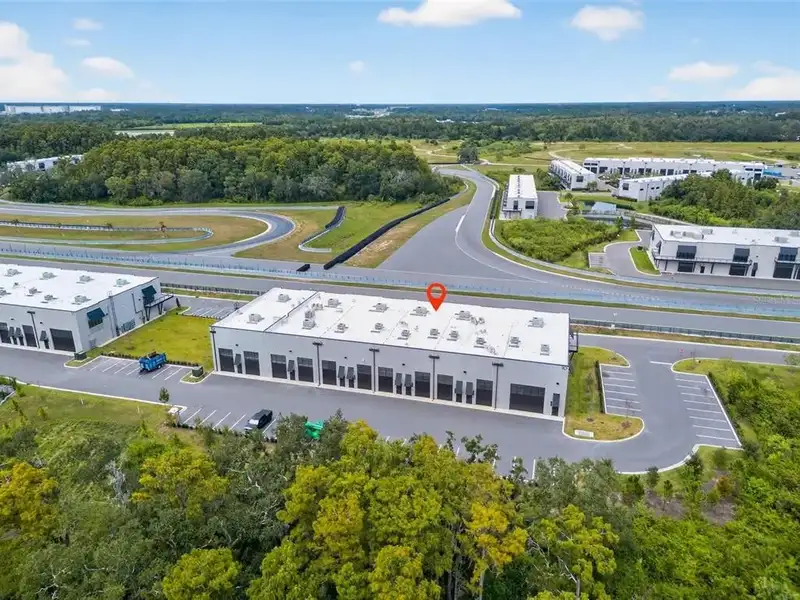 Exclusive Balcony Unit at the Motor Enclave with Private Garage and Racetrack Views
