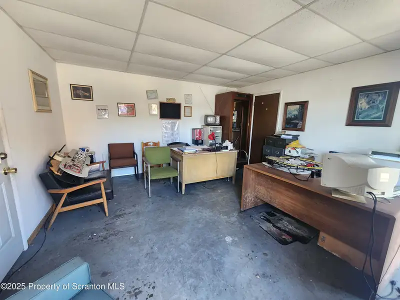 Versatile Commercial Property with Garage Bays and Billboard Income in Prime Location