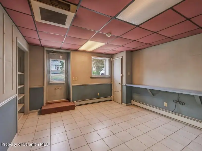 Mixed-use Property in Throop: 7-bay Garage and Updated 2-bedroom Apartment