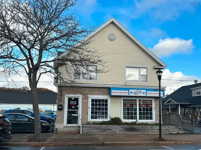 Downtown Kentville Commercial Retail Property with Residential Apartment and Ample Parking