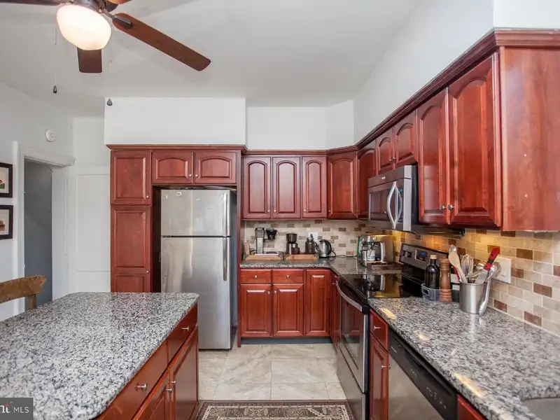 Multi-unit Building with Commercial Space and Two Residential Apartments in Established Location