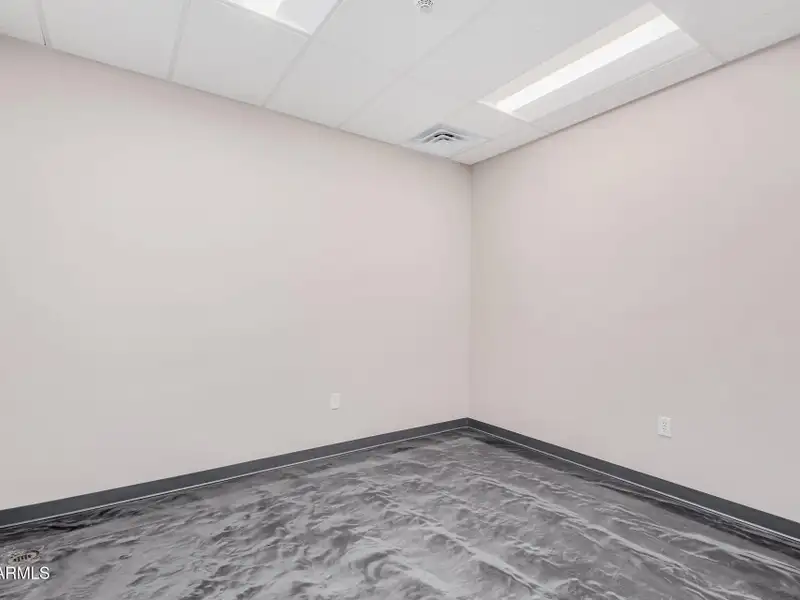 Versatile Commercial Property with Two Buildings and Ample Parking in Prime Location