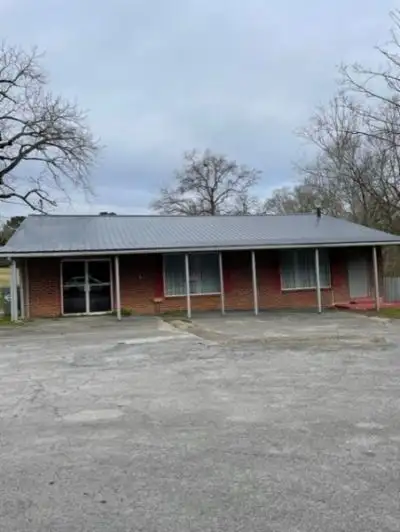 Versatile Former Restaurant on 2.4 Acres with Creek Access, Ideal for Development