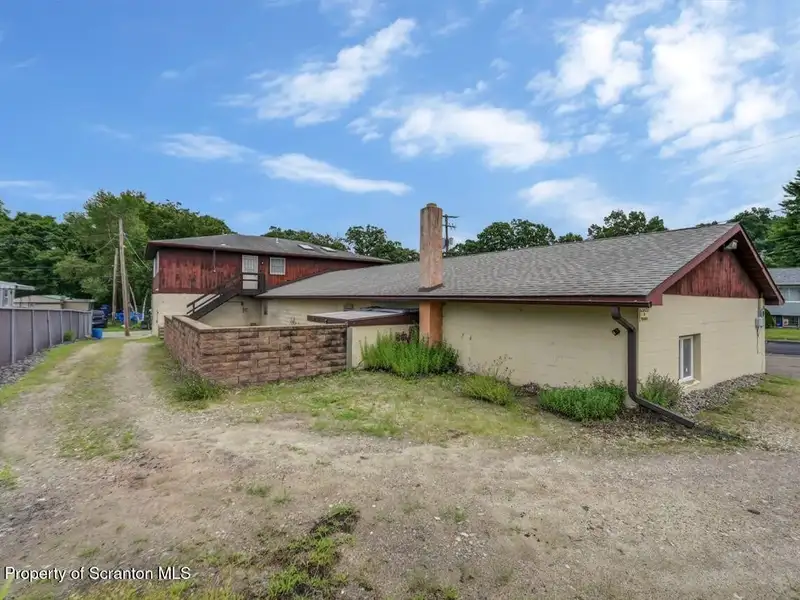 Mixed-use Property in Throop: 7-bay Garage and Updated 2-bedroom Apartment