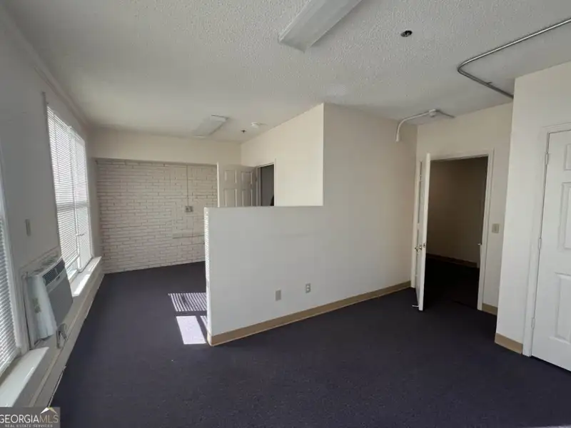 Two-level Commercial Unit with 26 Living/office Spaces in Re-zoned R4 Area