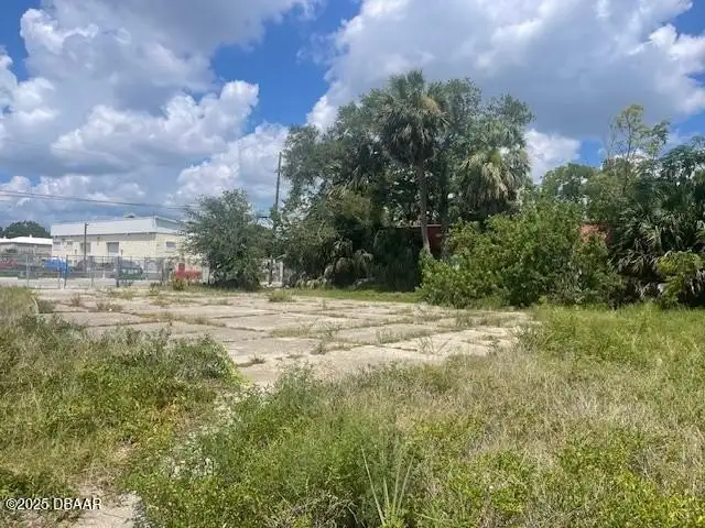 Multi-parcel Offering: Two-story Building with Renovation Potential in Prime Location