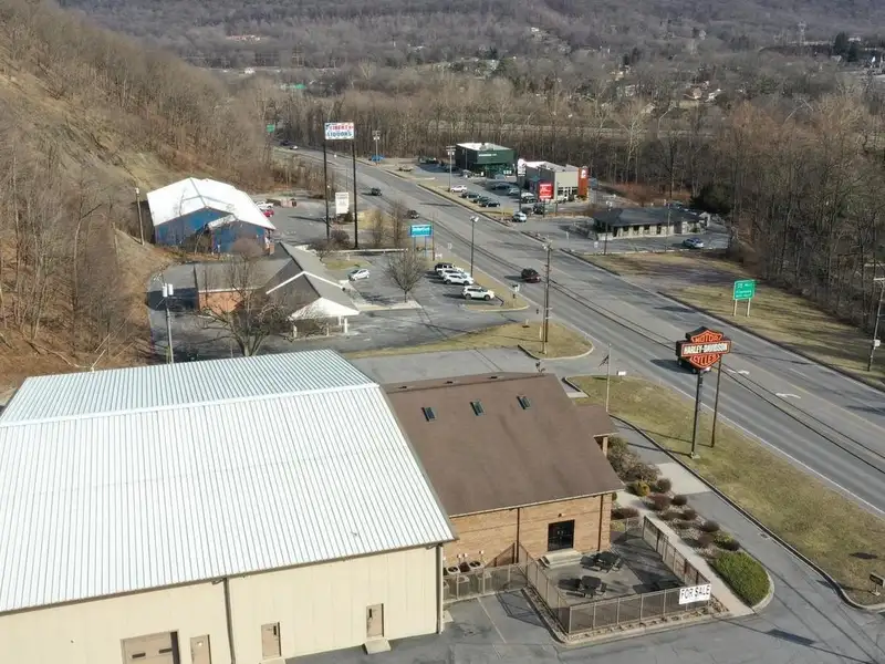 Versatile Commercial Property with Showroom, Offices, and Large Metal Building in Prime Location