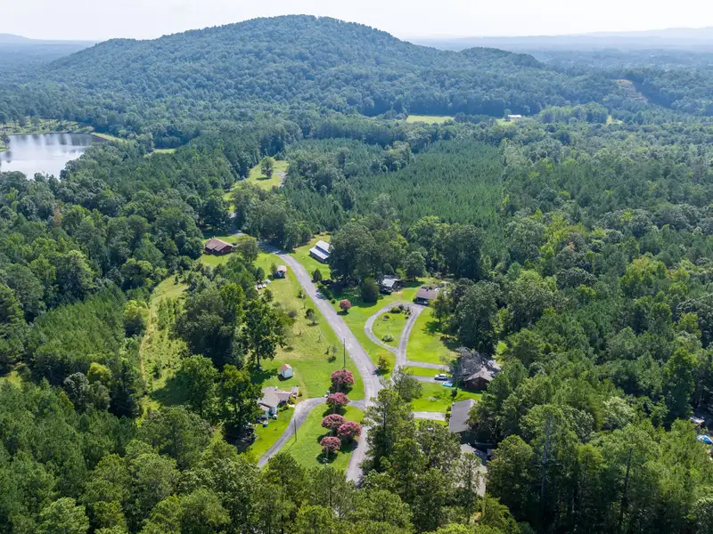 27 Acres with 2,400 Sq. Ft. Home, Duplexes, Pool, and Barn in Prime Location