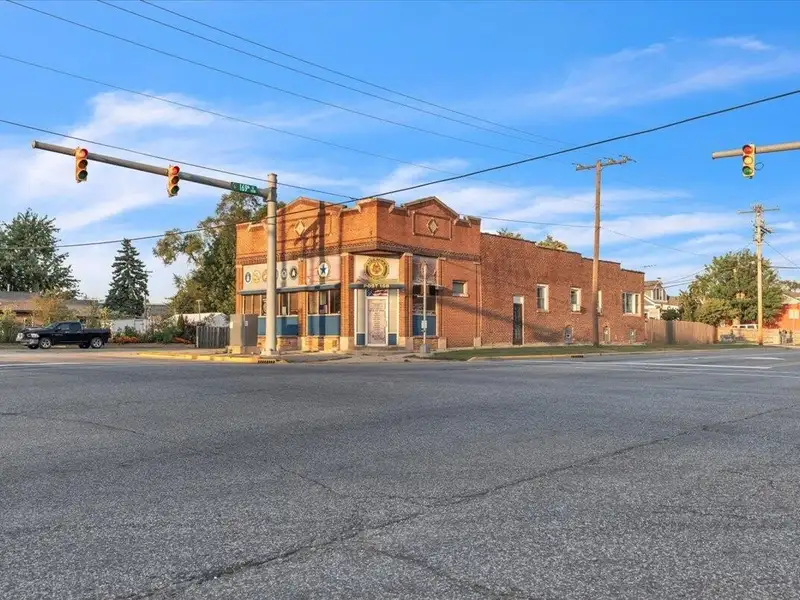 Versatile Corner Commercial Property with Retail Space and Two Apartments in Prime Location