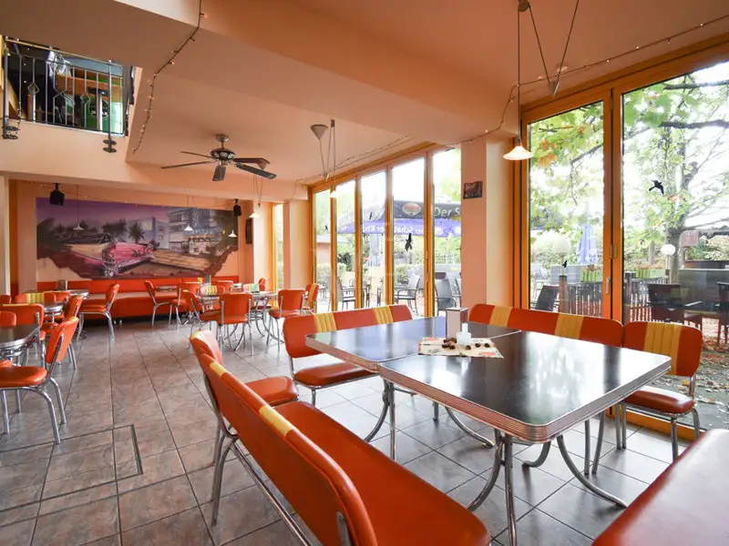 Fully Equipped Restaurant and Discotheque in Prime Volkach Location with Outdoor Seating